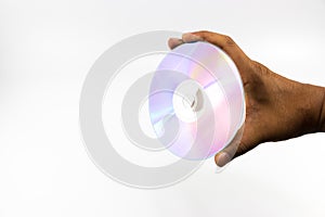 CD-ROM disc with rainbow reflective light in man hand