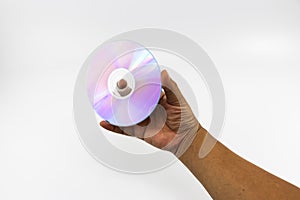 CD-ROM disc with rainbow reflective light on man hand isolated