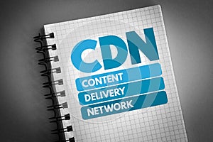 CDN - Content Delivery Network acronym on notepad, technology concept background