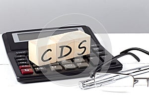 DEMAND ELASTICITY text on notebook with chart and keyboard