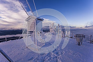Ceahlau Toaca weather station in winter landscape photo