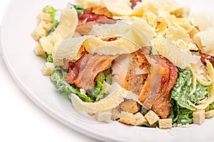 Ceasar salad on white plate, healthy food