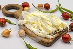 Cecil cheese or String cheese on a white background. Delicious assortment of cheeses