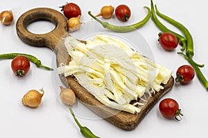 Cecil cheese or String cheese on a white background. Delicious assortment of cheeses