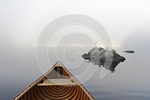 Cedar Canoe and Rocks on a Misty Ontario Lake