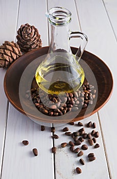 Cedar oil in a glass bottle. Still life, rustic style