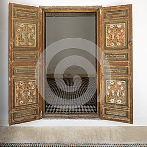 Cedar wood painted open doors in the Bahia Palace in Marrakesh, Morocco.