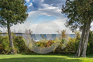 Cedars Frame Dramatic Sky Over Lake Michigan