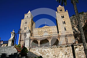 Cefalu cathedral on summer sky; Sicily
