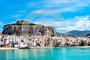 Cefalu, medieval town on Sicily island, Italy. Seashore village with beach and clear turquoise water of Tyrrhenian sea