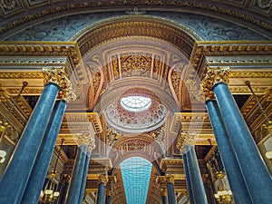 Ceiling architectural details with the glass dome and golden ornaments inside the Versailles palace hall, Gallery of Great Battles