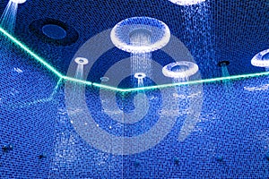 Ceiling in a blue shower room with dynamic LED lighting