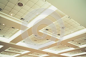 Ceiling of business interior office building and light neon. vintage style tone with copy space