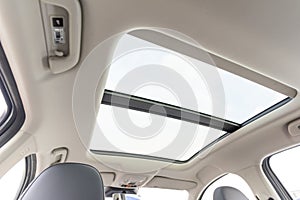 ceiling of the car with a transparent glass hatch for airing.