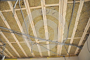 Ceiling construction detail. Close up on ceiling construction details with electricity wire. Building construction gypsum plaster