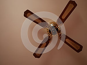 Ceiling fan. Creating air coolness on hot days. Dramatic cinematic atmosphere