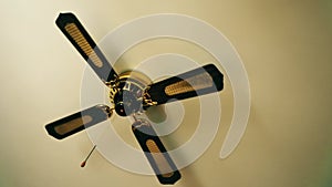 Ceiling fan. Creating air coolness on hot days. Dramatic cinematic atmosphere