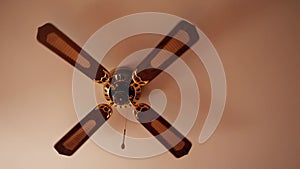 Ceiling fan. Creating air coolness on hot days. Dramatic cinematic atmosphere