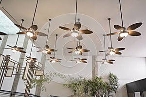 Ceiling fans, colonial style with lights on in a luxury resort in the background decorations a