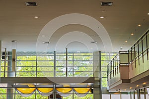 Ceiling and glass walls and and mezzanine in the lobby.