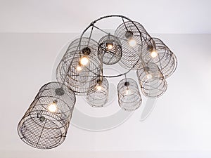 Ceiling lamp in birdcage designed