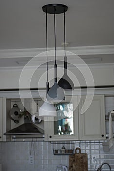 Ceiling lamp in modern kitchen. Interior of the house. photo
