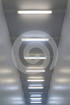 The ceiling with luminiscent lamps Inside white sterile cleanroom photo