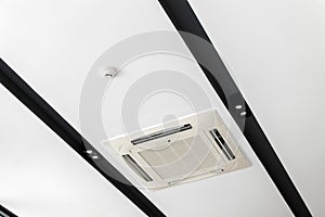 Ceiling mounted cassette type air conditioner, interior of a modern building