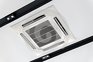 Ceiling mounted cassette type air conditioner, interior of a modern building