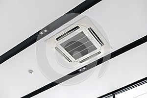 Ceiling mounted cassette type air conditioner, interior of a modern building