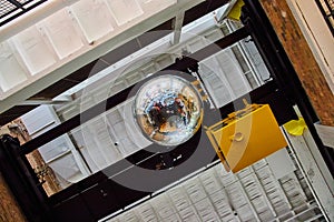 Ceiling of old building with large reflective disco ball