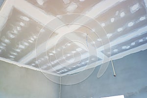 Ceiling of room after installation and coat for new house construction