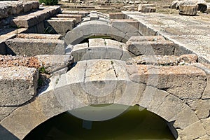 Ceiling ruins of ancient stone temple of Apollon in Klaros ancient city filled water photo