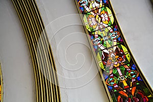 Ceiling of a semicircular form of the Soviet building with curved and multi-colored stained-glass windows. Old architecture.