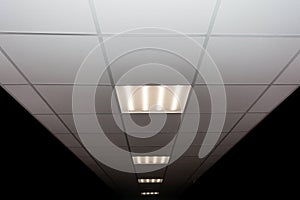 Ceiling of square porous plates and built-in LED lamp