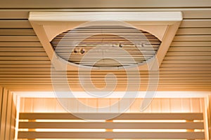 ceiling vent in sauna, showing light wooden slats