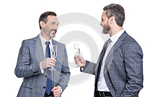 celebrate business partnership. two businessmen partner celebrating business deal with glass of champagne. successful