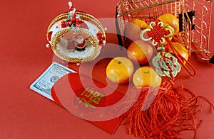 Celebrate Chinese New Year background with orange fruit and red envelope Ang Pau for U.S money