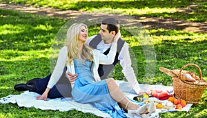 Celebrate love. Vintage style. Couple in love enjoying picnic time and food outdoors. Man and woman in love. Spring date