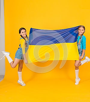 Celebrate national holiday. Patriotism respect and love to motherland. Girls with blue and yellow flag. Patriotic