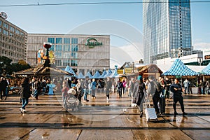 Berlin, October 03, 2017: Celebrating the Oktoberfest. People walk on the street market on the famous Alexanderplatz