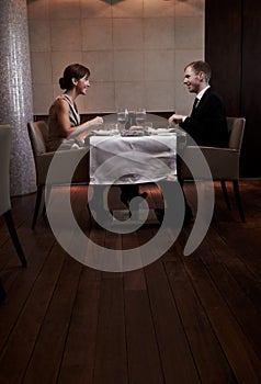 Celebrating in style. a couple having dinner in a restaurant.