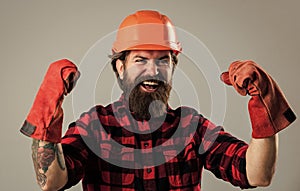 celebrating success. man in gloves. construction worker in hard hat. engineer architect working in safety helmet. brutal