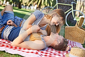 Celebrating their love with a picnic. A young couple having a picnic.