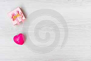 Celebration above ink heart and pink gift box various party