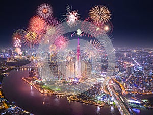 Celebration. Aerial view of Landmark 81 skyscraper with fireworks light up sky over business district in Ho Chi Minh City, Vietnam photo