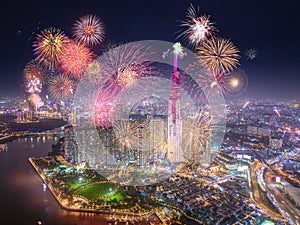 Celebration. Aerial view of Landmark 81 skyscraper with fireworks light up sky over business district in Ho Chi Minh City, Vietnam photo