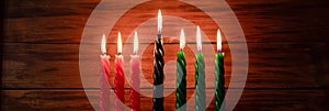 Celebration of African American Kwanzaa festival. Seven burning candles in Kinara candlestick. photo