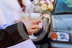 Celebration. Couple holding glasses of champagne making a toast.