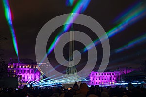 Celebration at Freedom Monument in Riga, Latvia with Colorful Lights